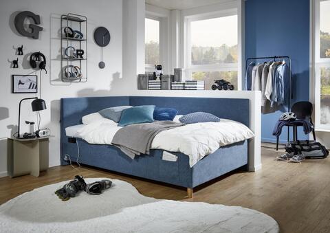 Čalúnená posteľ s rámom 140 - Coll modrá